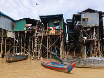 Boats moored in sea against sky