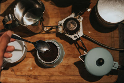 Top view of a man making coffee using mocha pot.close up shot.