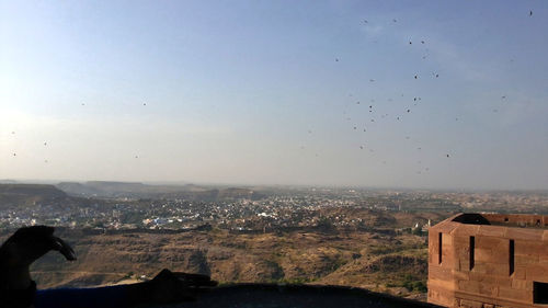 Aerial view of cityscape against sky