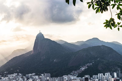 Panoramic view of buildings and mountains against sky