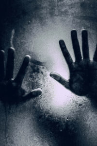 Close-up of hand on snow