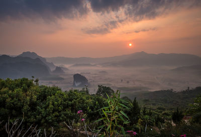 Scenic view of mountains against sky during sunset