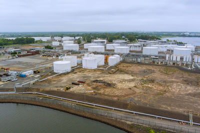 High angle view of factory by road against sky