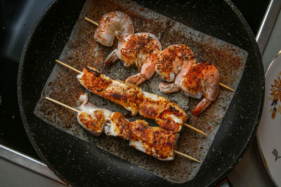 High angle view of meat in cooking pan