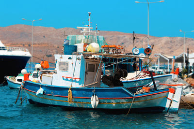 Fisherboat in sea against sky