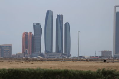 Modern buildings in city against sky