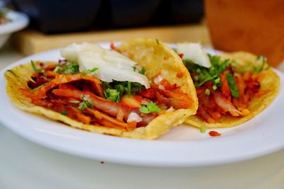 Close-up of tacos in plate on table