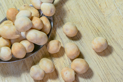 High angle view of beans in spoon on table