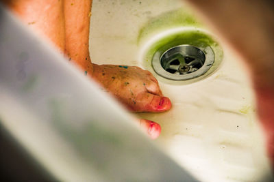Close-up of dirty feet in bathroom