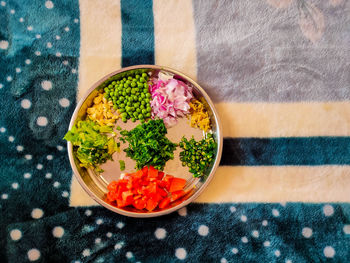 High angle view of chopped vegetables in bowl on table