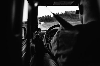 Close-up of man driving car