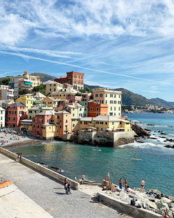 High angle view of buildings by sea against sky, boccadasse, genova, liguria