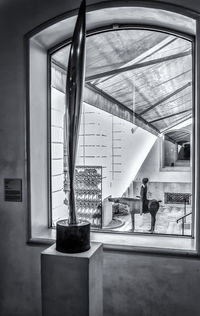 People standing in glass window