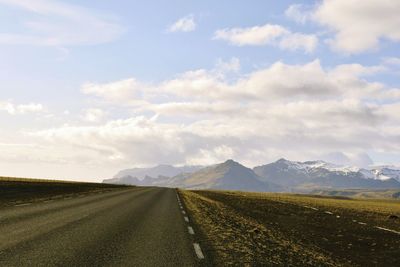 Road amidst landscape against sky