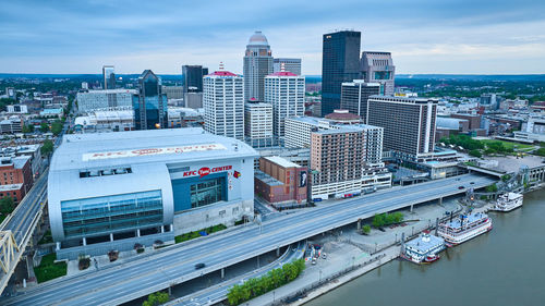 High angle view of buildings in city against sky