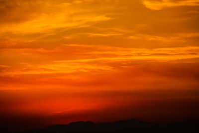 Scenic view of dramatic sky during sunset