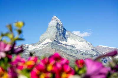 Scenic view of snow covered mountain against sky