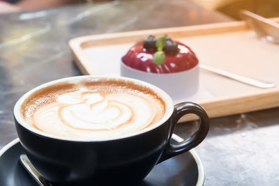 Close-up of cappuccino on table