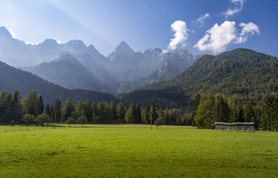 Scenic view of landscape and mountains against sky