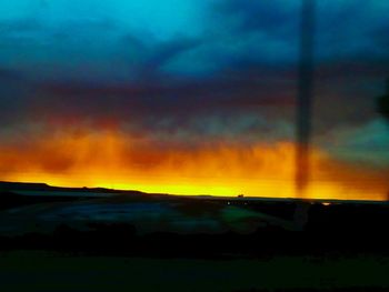 Scenic view of landscape against sky during sunset