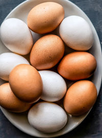 High angle view of eggs in carton on table