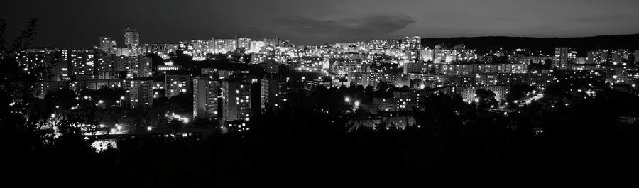 Aerial view of city lit up at night