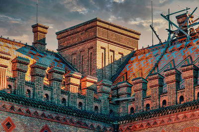 Decorative elements roof of an old house, university in chernivtsi. red brick house