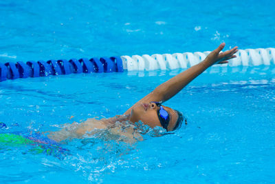 Boy swimming in pool