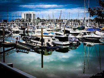 Boats moored at harbor