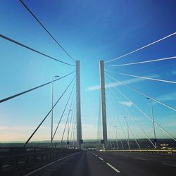 Suspension bridge against sky