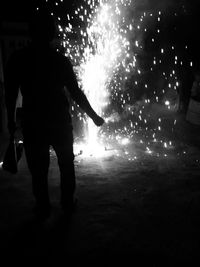 Man standing at night