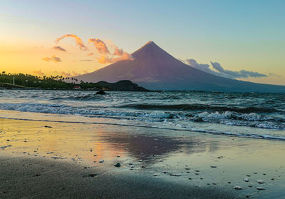 Scenic view of sea against sky during sunset