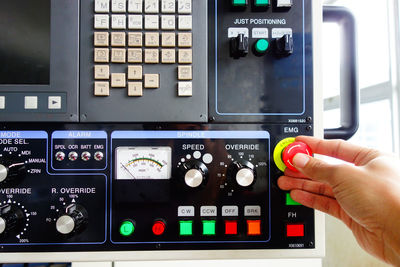 Close-up of hand using control panel
