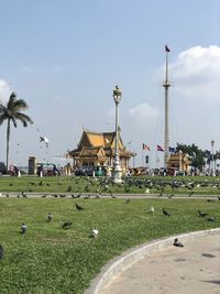 View of park and buildings against sky