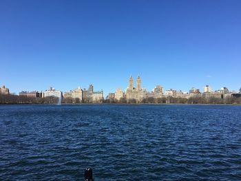 Buildings in distance with waterfront