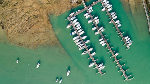 Aerial view of boats moored at harbor