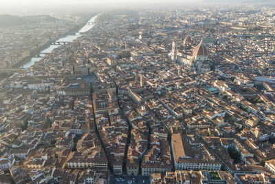 Aerial view of florence along the arno river and the old town from above, tuscany, italy,