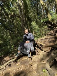 Woman sitting in a forest