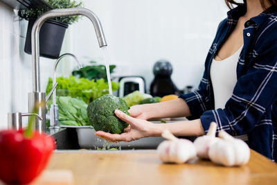 Woman preparing food in kitchen at home