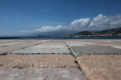 Surface level of landscape against blue sky and clouds