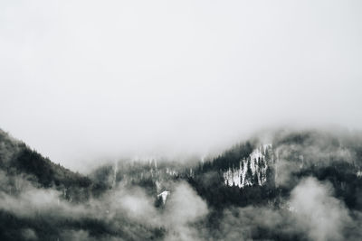 Scenic view of tree mountains against sky