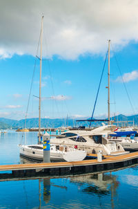 Boats moored at harbor