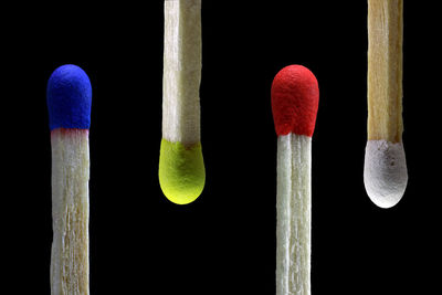 Close-up of multi colored pencils against black background