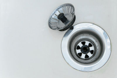 Close-up of drain in bathroom sink