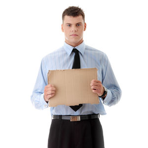 Portrait of man holding camera over white background