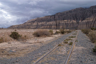 Scenic view of mountains against cloudy sky