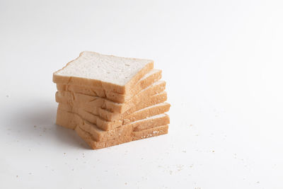 Close-up of cake against white background