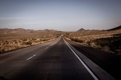 Road amidst landscape against clear sky