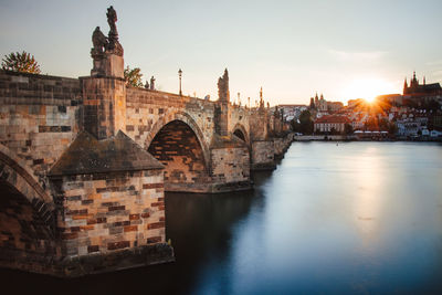 Famous stone bridge in prague in the czech republic known as charles bridge connects parts of city