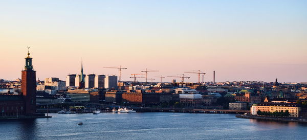 View of commercial dock against clear sky during sunset